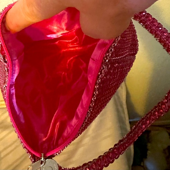 NWOT unlisted pink sparkle evening wristlet with zipper opening and closing. - Picture 2 of 2